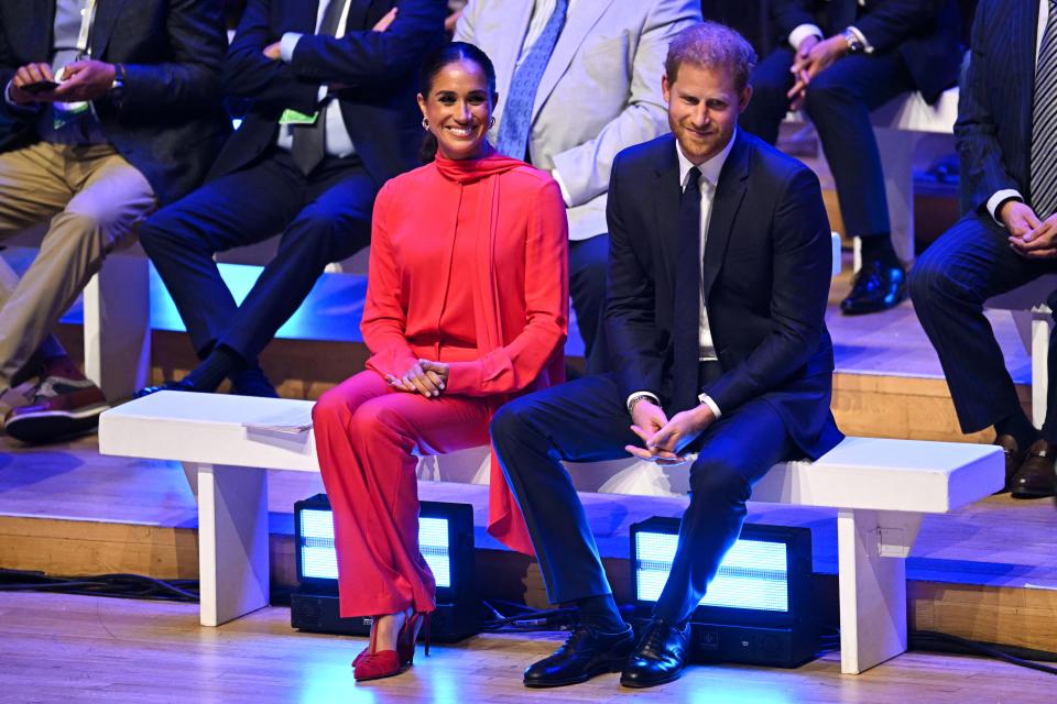 Britain's Meghan, Duchess of Sussex and Britain's Prince Harry, Duke of Sussex, react as they attend the annual One Young World Summit at Bridgewater Hall in Manchester, north-west England on September 5, 2022. - The One Young World Summit is a global forum for young leaders, bringing together young people from over 190 countries around the world to come together to confront the biggest challenges facing humanity. (Photo by Oli SCARFF / AFP) (Photo by OLI SCARFF/AFP via Getty Images)