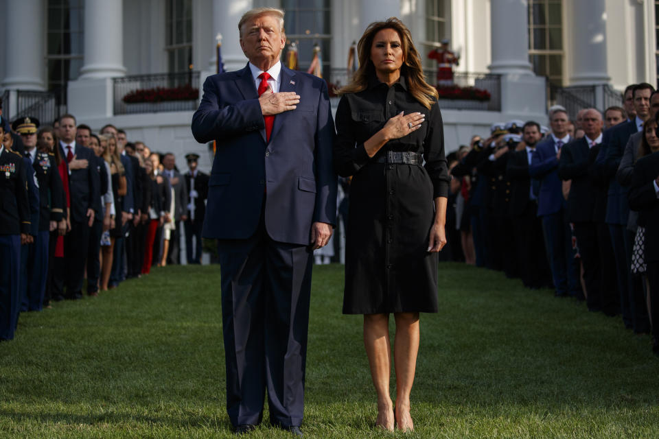 President Donald Trump and first lady Melania Trump participate in a moment of silence honoring the victims of the Sept. 11 terrorist attacks, on the South Lawn of the White House, Wednesday, Sept. 11, 2019, in Washington. (AP Photo/Evan Vucci)