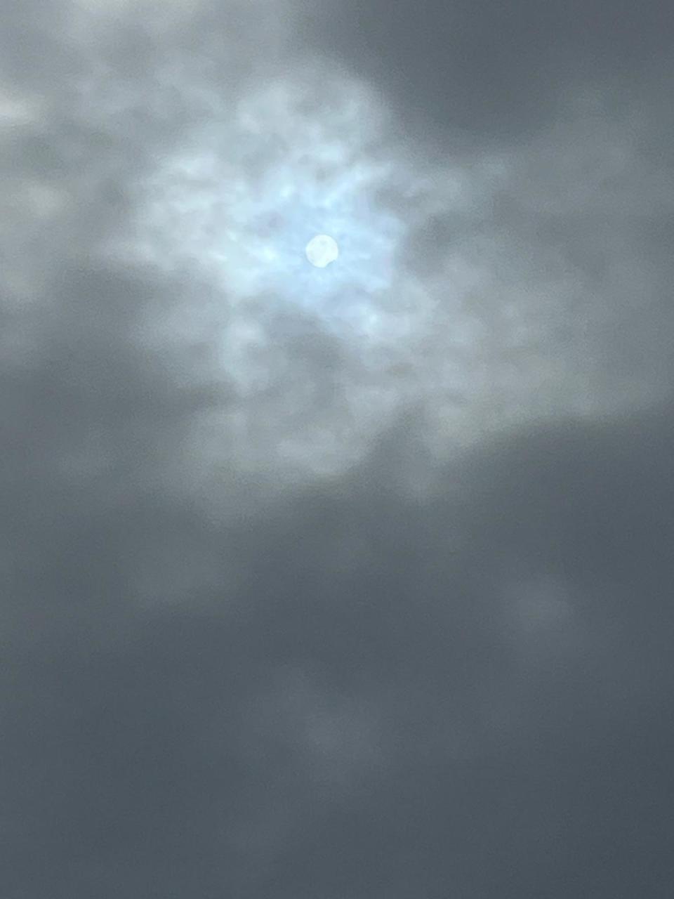 Cheers erupted as people caught the first glimpse of the total solar eclipse from Rochester, as the moon begins to take a bite out of the sun around 2:15 PM EDT on April 8, 2024.