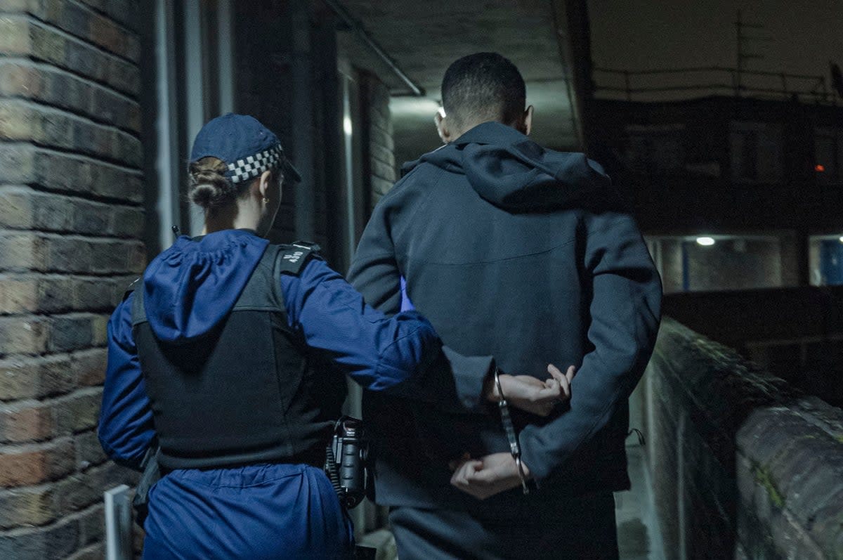 Police conducting a dawn raid in London  (Metropolitan police )