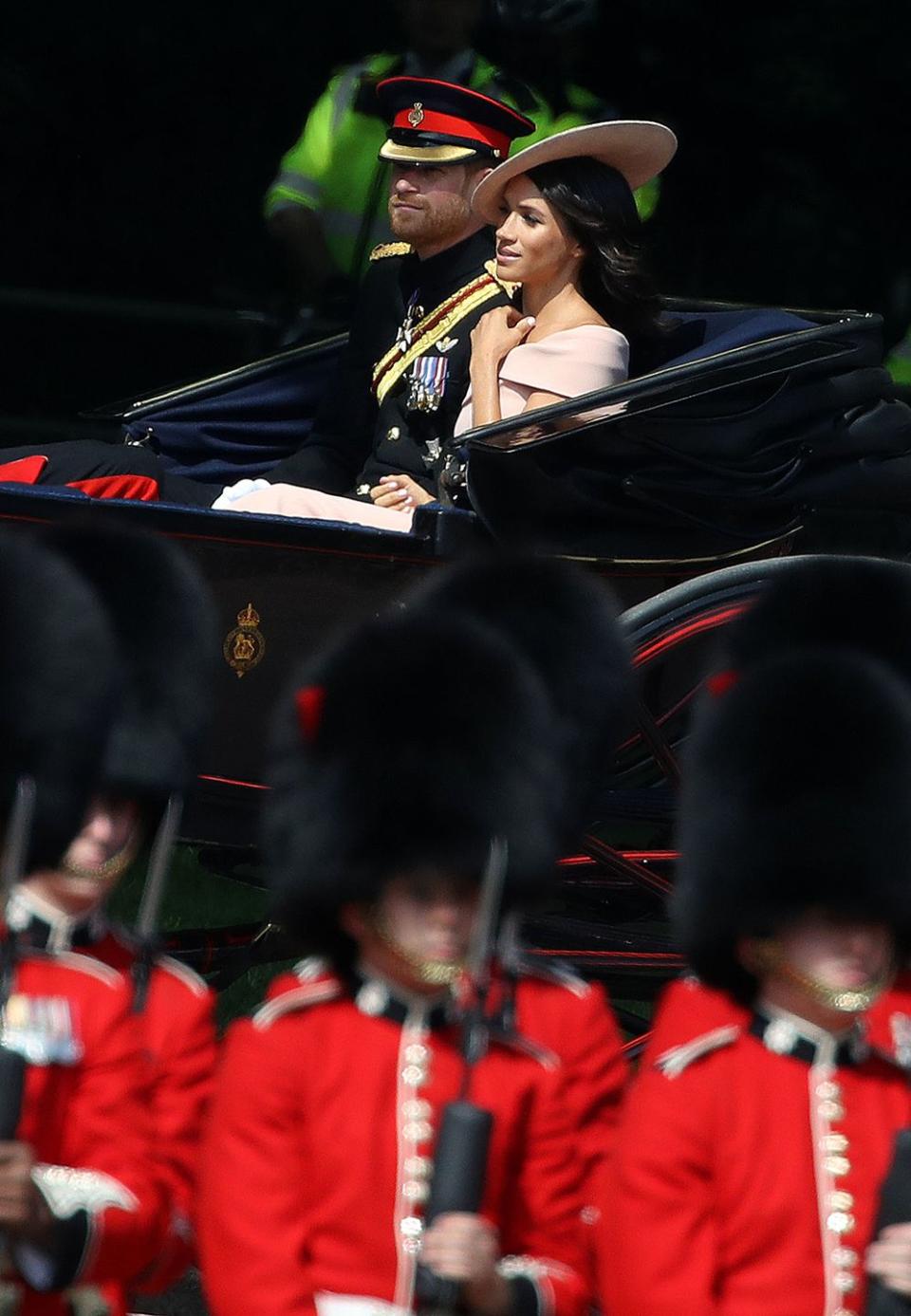 Meghan and Harry travel by carriage to the celebrations.