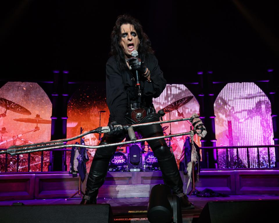 Alice Cooper stuck to his love of all things that go bump in the night with a giant boa, heavy makeup and more of his iconic looks.