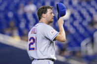 New York Mets starting pitcher Rich Hill adjusts his cap after walking Miami Marlins' Joe Panik during the fourth inning of a baseball game, Thursday, Aug. 5, 2021, in Miami. (AP Photo/Lynne Sladky)