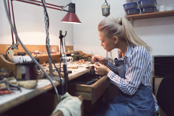 A jewelry maker working on some pieces
