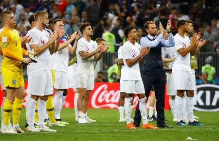 Soccer Football - World Cup - Semi Final - Croatia v England - Luzhniki Stadium, Moscow, Russia - July 11, 2018 England manager Gareth Southgate and his player applaud fans after the match REUTERS/Kai Pfaffenbach