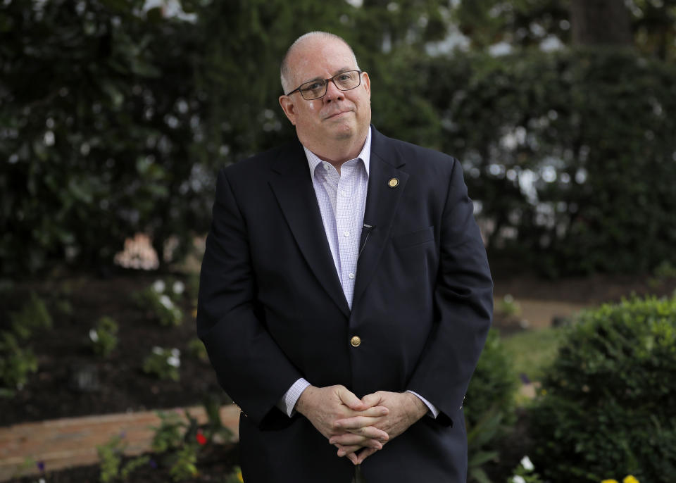 Maryland Gov. Larry Hogan poses for a photograph during an interview with The Associated Press to talk about his response to the coronavirus outbreak as chairman of the National Governors Association, Thursday, July 23, 2020, in Annapolis, Md. Hogan also discussed his book which is expected to be released next week. (AP Photo/Julio Cortez)