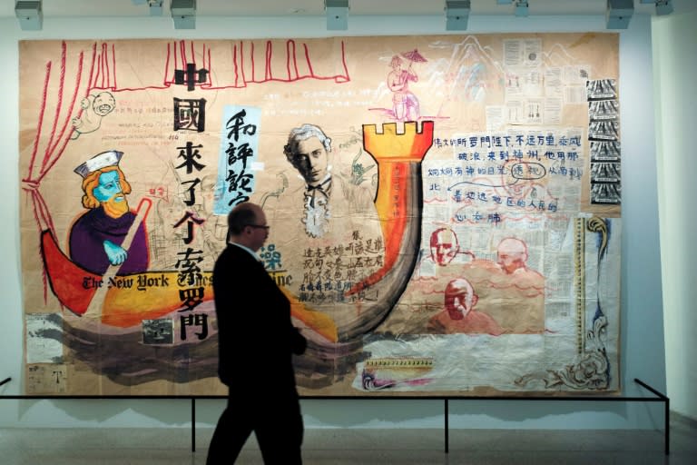 A man walks past Zhou Tiehai's "There Came a Mr Solomon to China" (1994)