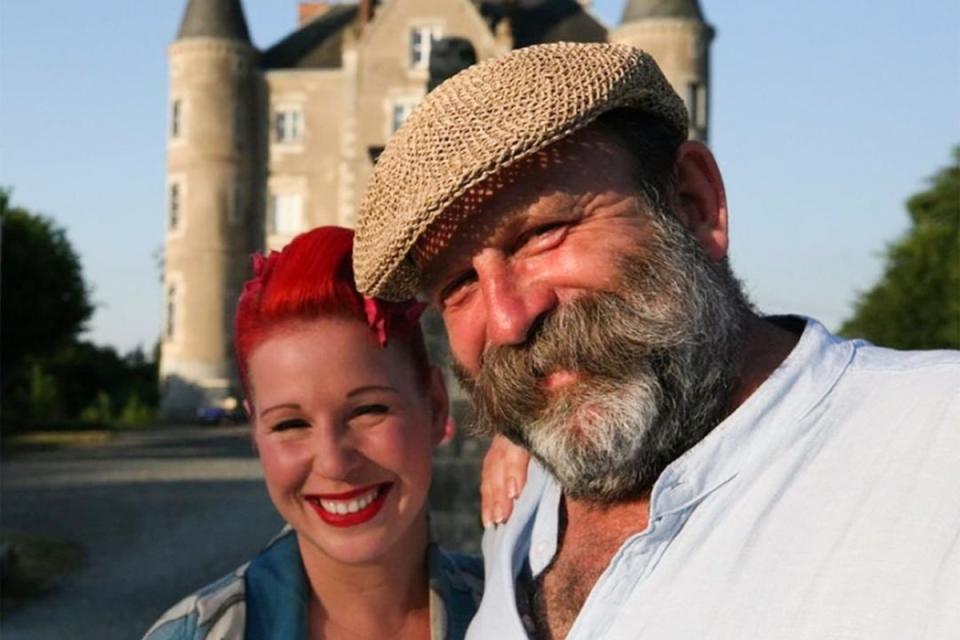 Angel and Dick Strawbridge infront of their chateau (escape_to_the_chateau/Instagram)