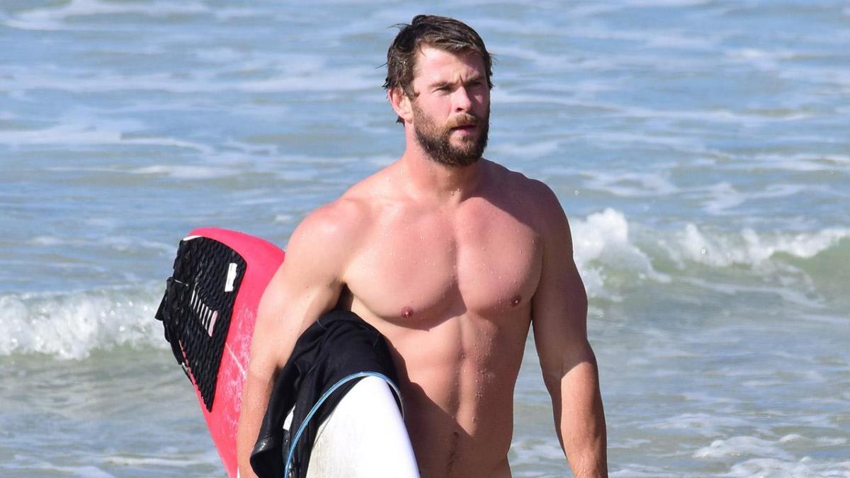 Chris Hemsworth shows off his incredibly toned body while surfing in Australia – check out the pictures!