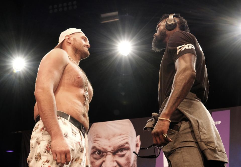 WBC heavyweight champion Tyson Fury and Deontay Wilder III face off in street clothes