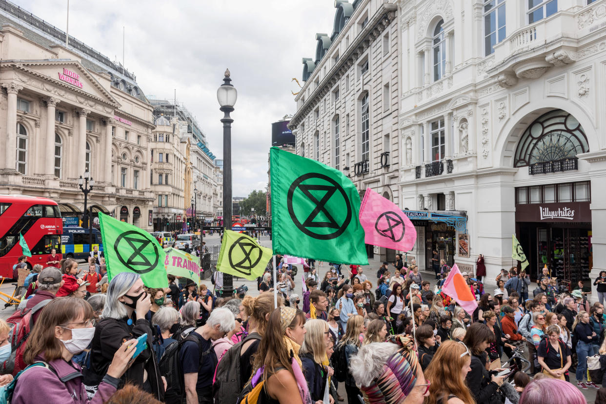 LONDON, UNITED KINGDOM - 2021/08/25: Protesters hold XR flags during the demonstration.
On the 3rd day of Extinction Rebellion's protests, protesters came together with the aim of demanding climate justice for the Indigenous people of Amazon rainforests in Brazil. They protest against ecocide and deforestation in Brazil. The group began their demonstration outside Brazilian Embassy in London, then moved over to Piccadilly Circus, and lastly occupying Oxford Circus. (Photo by Belinda Jiao/SOPA Images/LightRocket via Getty Images)