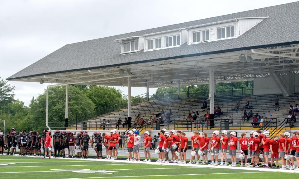 Peoria High and Morton football players wait on the sidelines for their chance to play in a joint 7-on-7 football practice Tuesday, July 16, 2024 at Peoria Stadium.