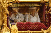 <p>LONDON, ENGLAND - MAY 06: King Charles III and Queen Camilla travel in the Gold State Coach, back to Buckingham Palace following the Coronation of King Charles III and Queen Camilla at Westminster Abbey on May 6, 2023 in London, England. The Coronation of Charles III and his wife, Camilla, as King and Queen of the United Kingdom of Great Britain and Northern Ireland, and the other Commonwealth realms takes place at Westminster Abbey today. Charles acceded to the throne on 8 September 2022, upon the death of his mother, Elizabeth II. (Photo by Sebastien Bozon - WPA Pool/Getty Images)</p> 