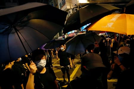 Anti-extradition bill demonstrators march to the Chinese Liaison Office after a march to call for democratic reforms, in Hong Kong