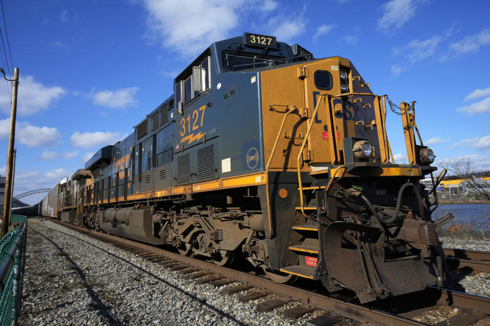 FILE - A CSX freight train sits on a siding in downtown Pittsburgh, Nov. 19, 2022. Lawyers and unions who represent rail workers say there is a clear pattern across the industry of railroads retaliating against workers who report safety violations or injuries on the job. (AP Photo/Gene J. Puskar, File)