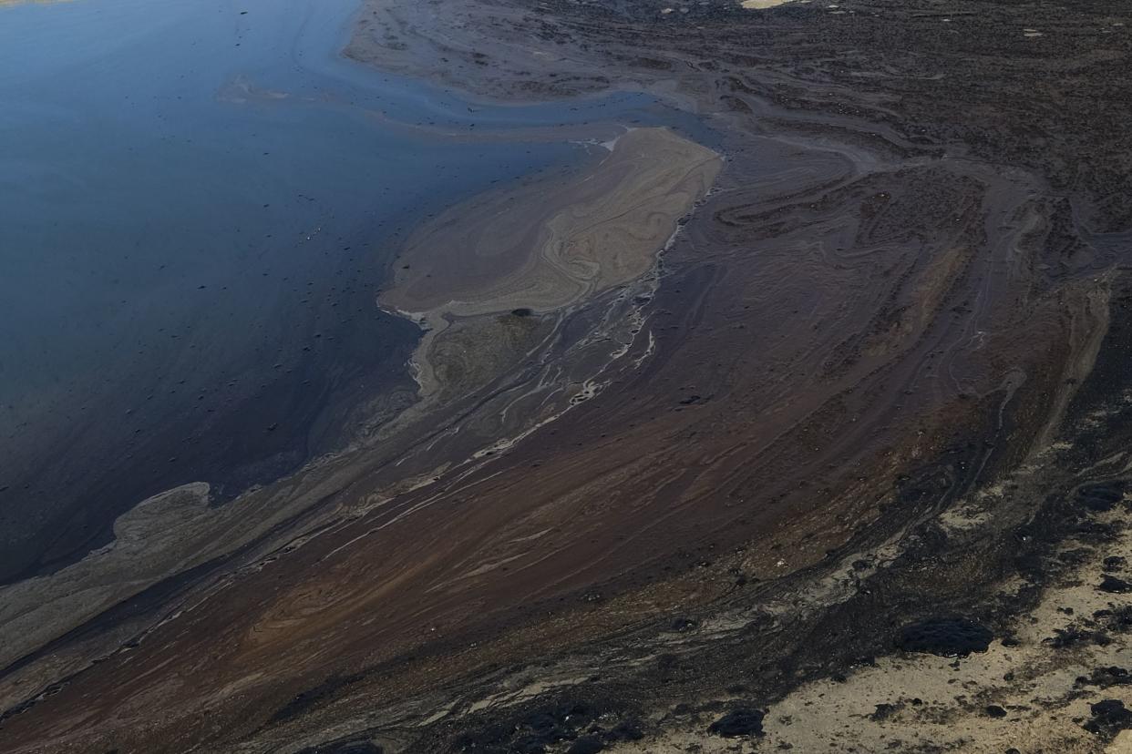 Oil washed up on Huntington Beach, Calif., on Sunday, Oct. 3, 2021.