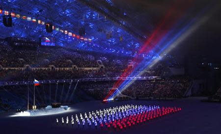 The colours of the Russian flag are seen during the opening ceremony of the 2014 Sochi Winter Olympics, February 7, 2014. REUTERS/Mark Blinch