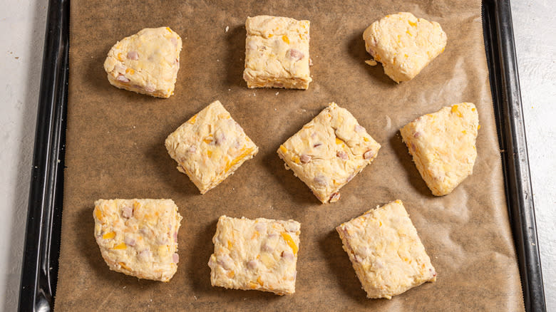 Raw biscuits on a baking tray