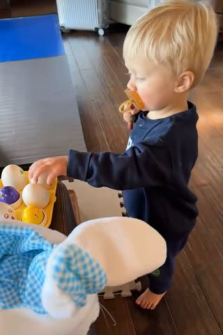 <p>Snapchat</p> Ryker plays with toy eggs