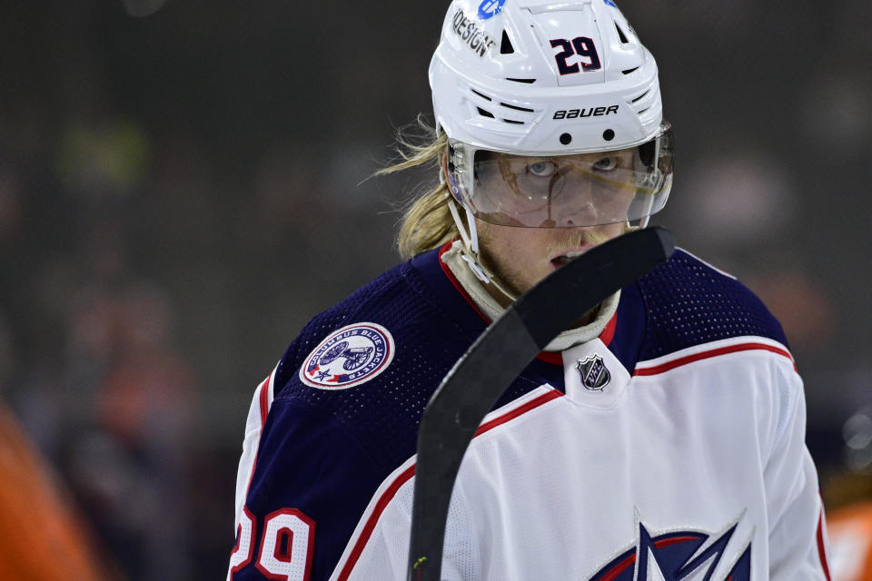 FILE - Columbus Blue Jackets' Patrik Laine pauses during the team's NHL hockey game against the Philadelphia Flyers, April 5, 2022, in Philadelphia. The Blue Jackets pulled off the improbable, landing the hottest free agent on the market in winger Johnny Gaudreau. The question is who will center the top line with Gaudreau and Laine. (AP Photo/Derik Hamilton, File)