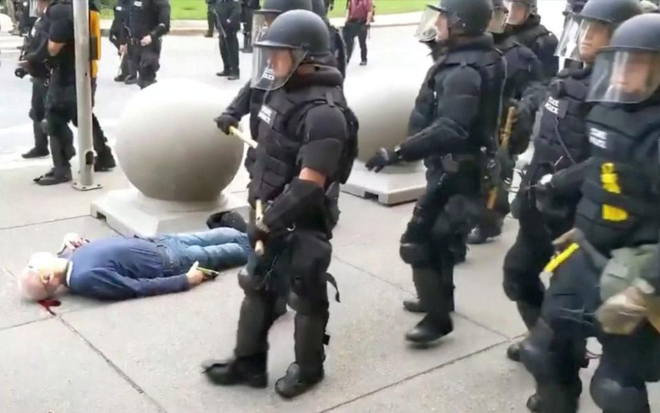 An elderly man bleeds from his ears after falling, after appearing to be shoved by riot police during a protest against the death in Minneapolis police custody of George Floyd, in Buffalo, New York, U.S. June 4, 2020  - WBFO/Reuters TV