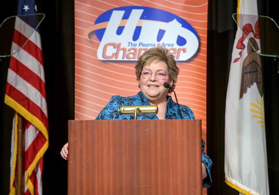 Carol Merna, executive director of The Center for Prevention of Abuse, accepts the award for Outstanding Small Business (26-150) during the annual Peoria Area Chamber of Commerce Thanksgiving Luncheon on Thursday, Nov. 16, 2023 at the Peoria Civic Center.