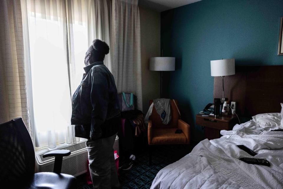 Betty Johnson looks out the window of her hotel room at Fairfield Inn by Mariott Northlake in Charlotte, N.C., on Friday, March 10, 2023.