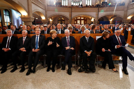 German Chancellor Angela Merkel, President Frank-Walter Steinmeier, his wife Elke Buedenbender, President of Germany's lower house of parliament Bundestag Wolfgang Schaeuble and President of the Central Council of Jews in Germany Josef Schuster take part in a ceremony to mark the 80th anniversary of Kristallnacht, also known as Night of Broken Glass, at Rykestrasse Synagogue, in Berlin, Germany, November 9, 2018. REUTERS/Fabrizio Bensch