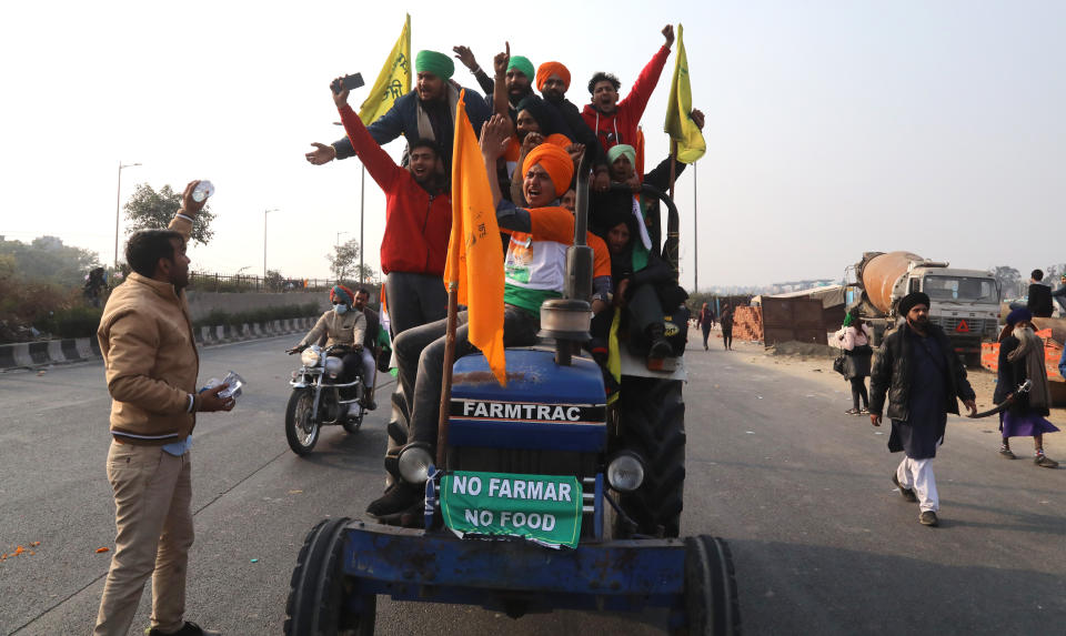 NEW DELHI, INDIA - 2021/01/26: Protesters ride on their tractor during the demonstration. Thousands of farmers from Punjab and Haryana state continue to protest against the central government's new agricultural Laws. Delhi Police gave permission to protesting farmers' tractor parade on Republic Day. The parade started from Singhu, Tikri and Ghazipur borders points. (Photo by Naveen Sharma/SOPA Images/LightRocket via Getty Images)