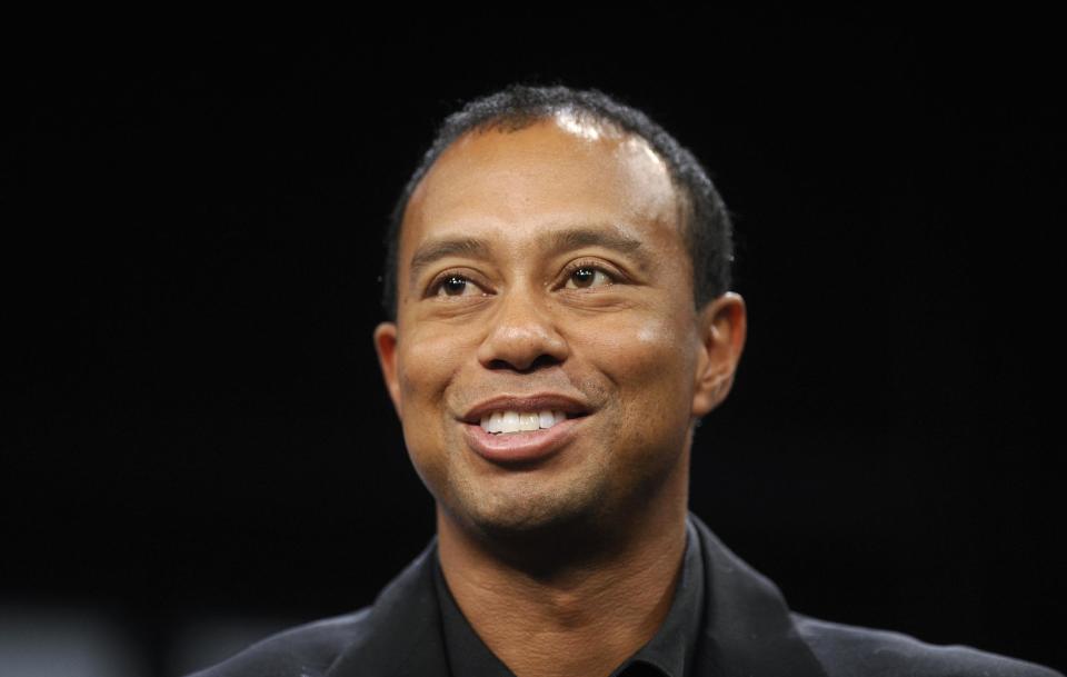 Tiger Woods speaks during a news conference at the Newseum in Washington, Monday, March 24, 2014. Woods discussed a deal through 2017 for his tournament to be called the Quicken Loans National to be played at Congressional in Bethesda, Md., in June. (AP Photo/Susan Walsh)