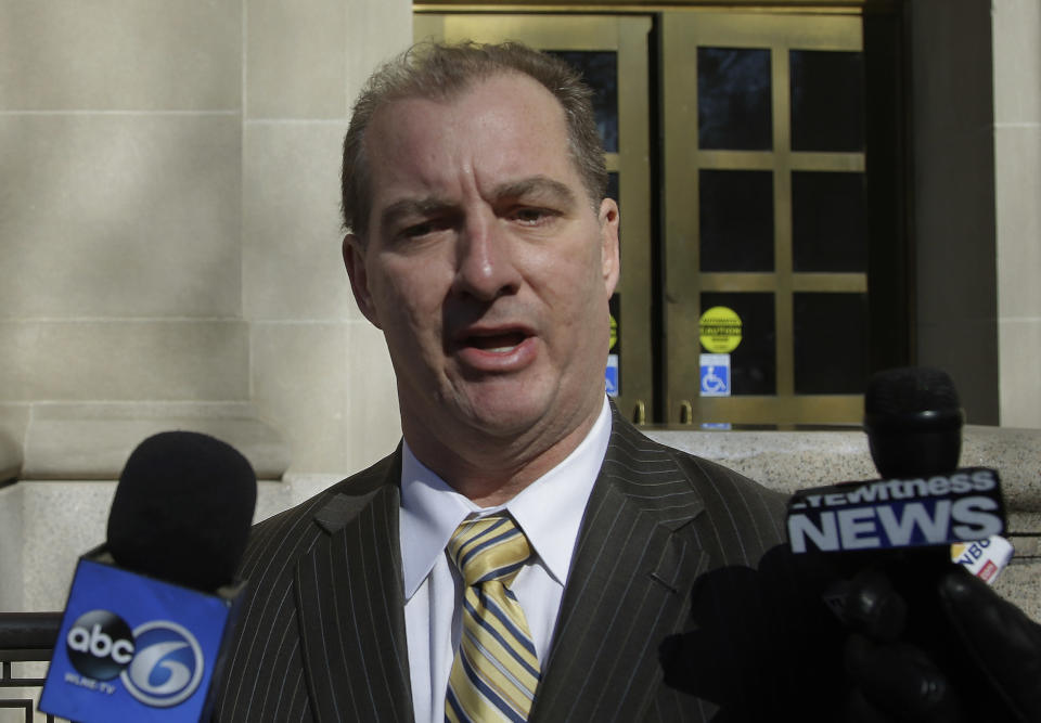 Former Central Falls, RI., mayor Charles Moreau pauses briefly to say a few words to the media as he leaves the Federal Courthouse a free man in Providence, RI., Friday, Feb. 28, 2014. Moreau was released from federal prison Friday after serving just under one year of a two-year sentence. Moreau was released after first pleading guilty to a new charge of accepting a bribe and being sentenced on that charge to time served. As part of the deal, U.S. District Court Judge John McConnell then vacated Moreau's 2012 conviction, allowing him to walk free. (AP Photo/Stephan Savoia)