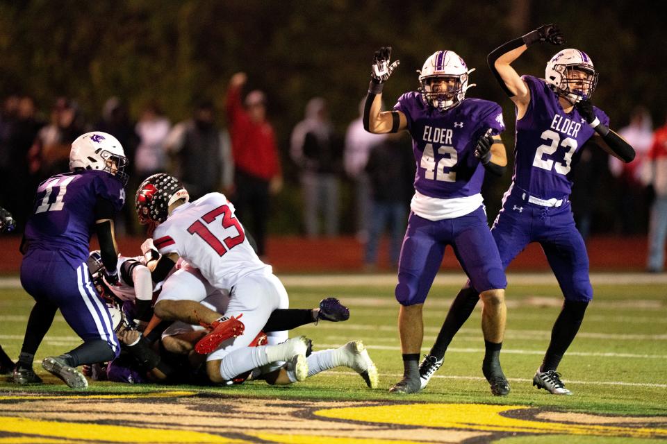 Cincinnati Elder's Ben Voelkerding (42) and Luke Paff (23) celebrate a fumble recovery during last year's Division I playoff loss to West Chester Lakota West.