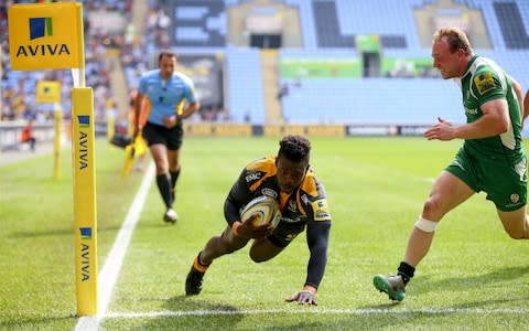 Christian Wade of Wasps touches down a try during the Aviva Premiership match between Wasps and London Irish at the Ricoh Arena on May 07, 2016 in Coventry, England - Credit: Getty Images