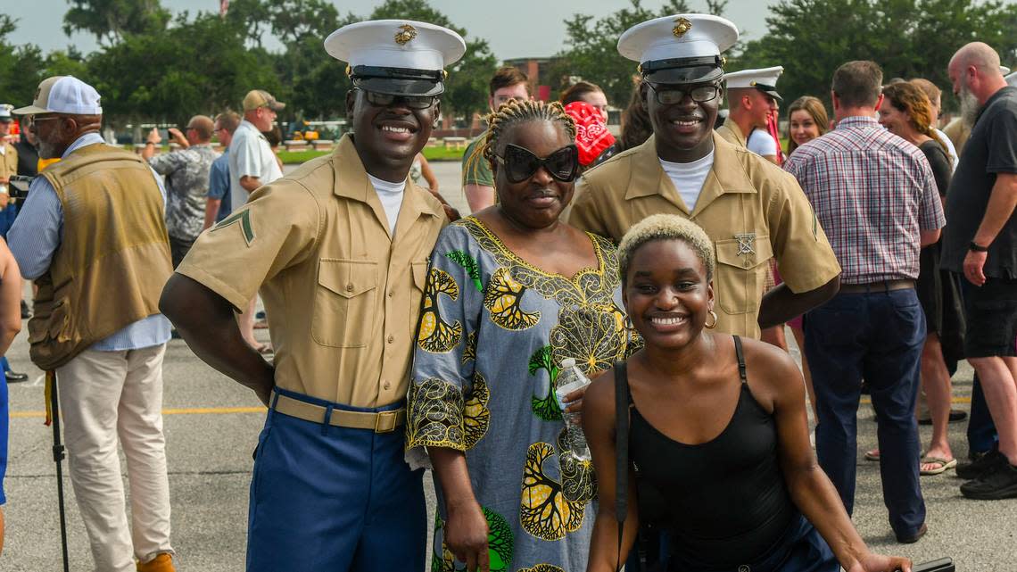 Twin brothers Rocher Landou, left and Puissance Landou pose for a photo with their mother Alice Landou, center and their sister Belinda Landou on Friday, June 30, 2023 after graduating at Marine Corps Recruit Depot Parris Island. The brothers wanted to enlist in the Marine Corps after the family immigrated from The Democratic Republic of the Congo.