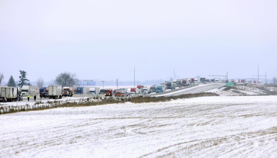 Emergency crews respond to a multi-vehicle accident in both the north and south lanes of Interstate 39/90 on Friday, Jan. 27, 2023, in Turtle, Wis. Authorities say snowy conditions led to the massive traffic pile-up in southern Wisconsin on Friday that left Interstate 39/90 blocked for hours. (Anthony Wahl/The Janesville Gazette via AP)