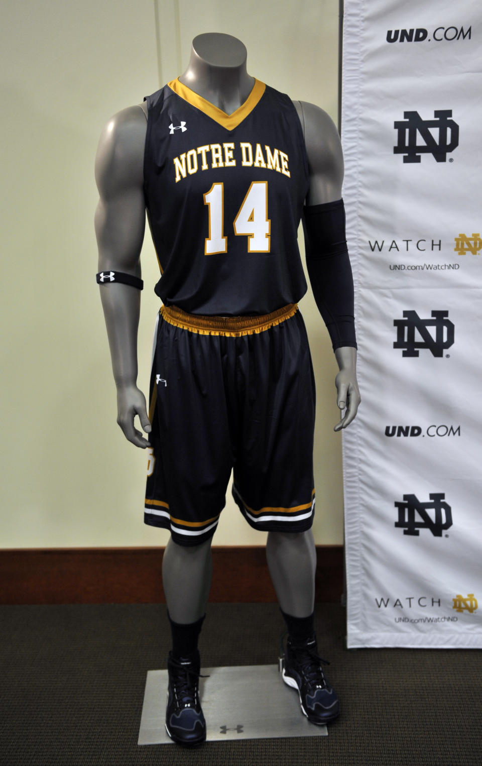 A new Notre Dame basketball uniform is displayed at a news conference Tuesday Jan. 21, 2014 in South Bend, Ind., announcing an agreement between Notre Dame and Under Armour that will outfit the university's athletic teams (AP Photo/Joe Raymond)