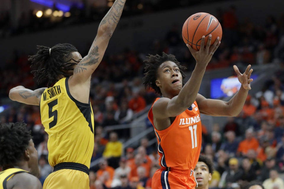 Illinois' Ayo Dosunmu (11) heads to the basket past Missouri's Mitchell Smith (5) during the first half of an NCAA college basketball game Saturday, Dec. 21, 2019, in St. Louis. (AP Photo/Jeff Roberson)