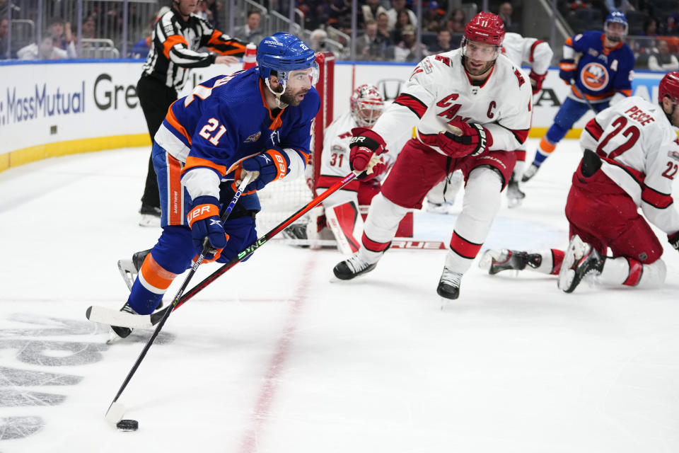 New York Islanders' Kyle Palmieri (21) is defended by Carolina Hurricanes' Jordan Staal (11) during the second period of Game 6 of an NHL hockey Stanley Cup first-round playoff series Friday, April 28, 2023, in Elmont, N.Y. (AP Photo/Frank Franklin II)