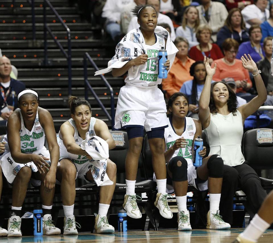 Notre Dame guard Lindsay Allen (15) celebrates a goal in the closing seconds of the second half of the semifinal game against Maryland in the Final Four of the NCAA women's college basketball tournament, Sunday, April 6, 2014, in Nashville, Tenn. Notre Dame won 87-61. (AP Photo/Mark Humphrey)