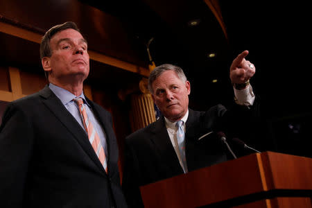 Senate Intelligence Committee Chairman Sen. Richard Burr (R-NC), accompanied by Senator Mark Warner (D-VA), vice chairman of the committee, speaks at a news conference to discuss their probe of Russian interference in the 2016 election on Capitol Hill in Washington, D.C., U.S., March 29, 2017. REUTERS/Aaron P. Bernstein