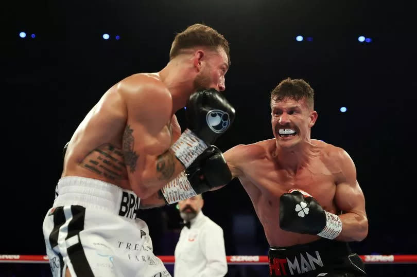 Nathan Heaney punches Brad Pauls (Photo by James Chance/Getty Images) -Credit:(Photo by James Chance/Getty Images)