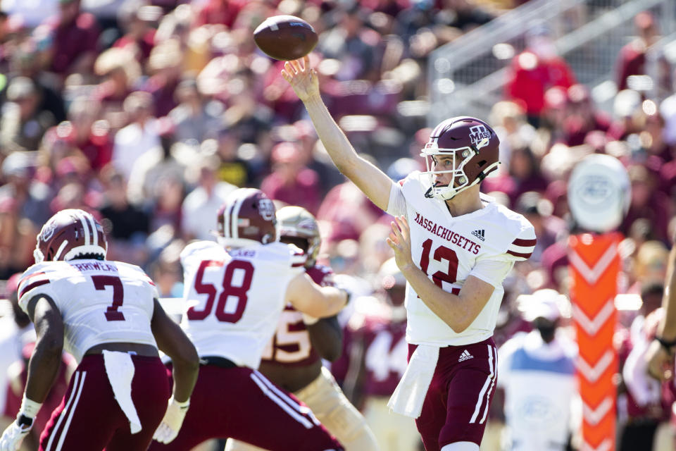 Massachusetts quarterback Brady Olson (12) passes in the first half of an NCAA college football game against Florida State in Tallahassee, Fla., Saturday, Oct. 23, 2021. (AP Photo/Mark Wallheiser)