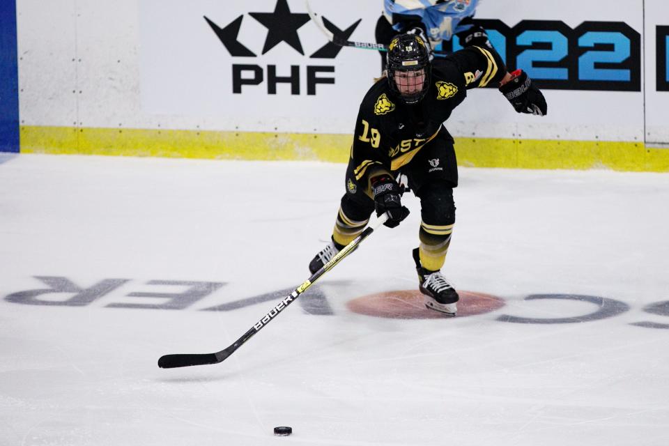 Boston Pride forward Sammy Davis, of Pembroke, chases a loose puck during a PHF playoff game in Wesley Chapel, Florida, on March 25, 2022.
