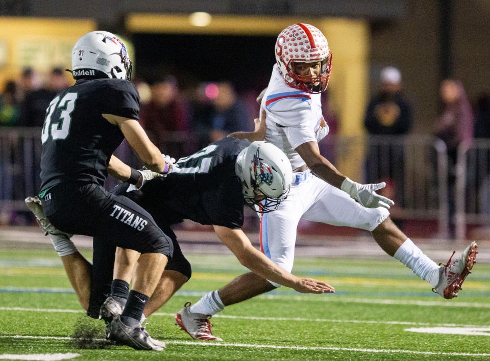 South Salem's Jaxon Watson (7) outruns West Salem defense during the game on Friday, Sept. 30, 2022 in West Salem, Ore. 