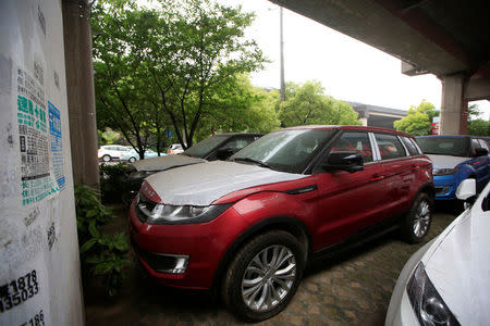 Landwind X7 cars are seen outside a dealership in Shanghai, China, June 3, 2016. REUTERS/Aly Song