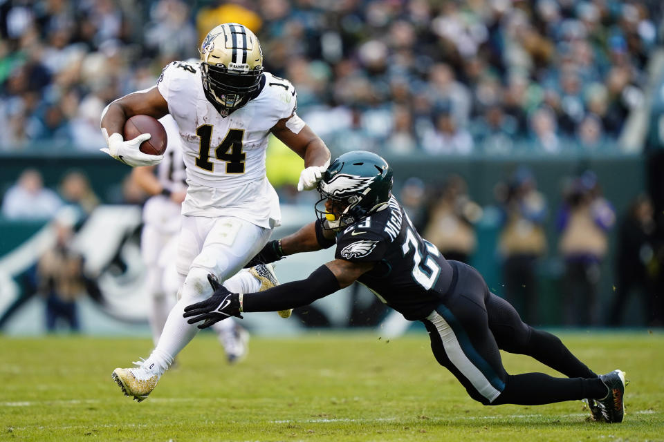 New Orleans Saints' Mark Ingram (14) runs against Philadelphia Eagles' Rodney McLeod (23) during the second half of an NFL football game, Sunday, Nov. 21, 2021, in Philadelphia. (AP Photo/Matt Rourke)