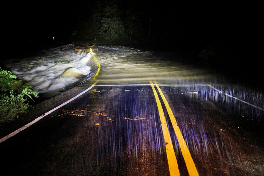 Flood waters wash over Guy Ford Road bridge on the Watauga River as Hurricane Helene approaches in the North Carolina mountains, in Sugar Grove on Sept. 26.<span class="copyright">Jonathan Drake—Reuters</span>