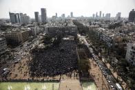 African migrants gather for a protest at Rabin Square in Tel Aviv January 5, 2014. About 10,000 African migrants, largely from Sudan and Eritrea, protested in central Tel Aviv on Sunday against Israel's slow processing of asylum requests and arrests of hundreds under an Israeli law, approved last month and contested by human rights groups, which entitles the authorities to detain migrants lacking valid visas without charges. REUTERS/Nir Elias (ISRAEL - Tags: POLITICS SOCIETY IMMIGRATION CIVIL UNREST)