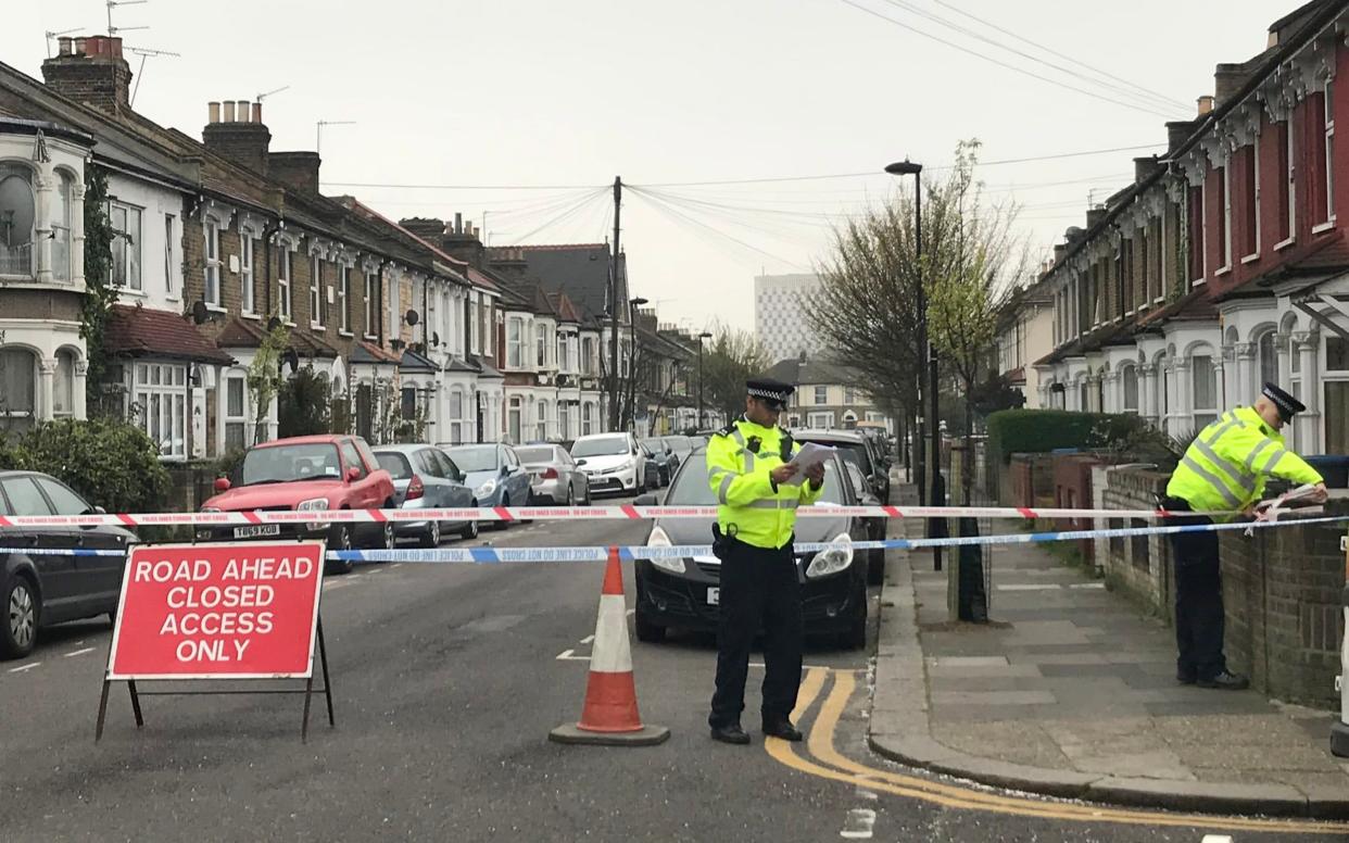 Police activity near the scene of a knife attack in Edmonton this morning - PA