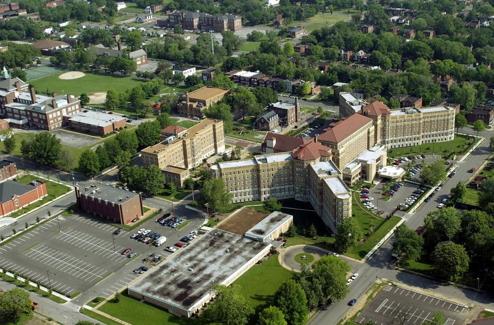 This aerial photo shows the Homer G. Phillips Senior Living Community, right, in the Ville neighborhood of St. Louis, that occupies the old Homer G. Phillips Hospital, May 18, 2004. A new Homer G. Phillips Memorial medical facility opened in the city and some people see the new name as an affront to the original, which is a recognized historic landmark. (Jerry Naunheim Jr./St. Louis Post-Dispatch via AP)